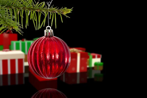 Композитное изображение красного рождественского украшения, свисающего с ветки — стоковое фото