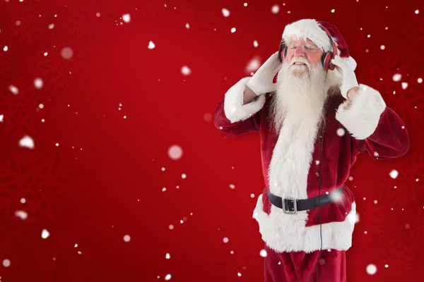 Santa Claus cieszy się trochę muzyki — Zdjęcie stockowe