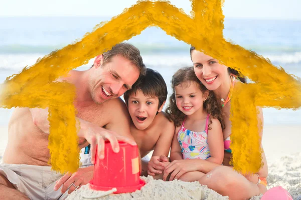 Composite image of family at the beach — Stock Photo, Image