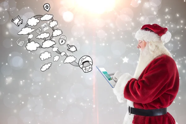 Santa uses a tablet pc — Stock Photo, Image