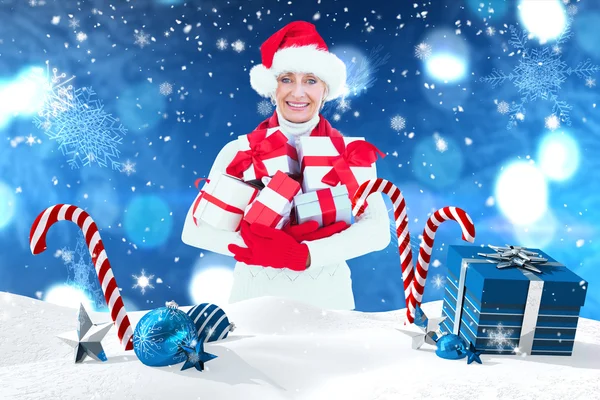 Festive woman holding gifts — Stock Photo, Image