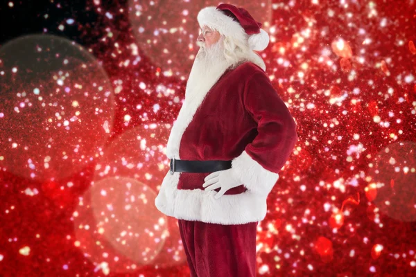 Santa Claus pokazuje jego boku do aparatu — Zdjęcie stockowe