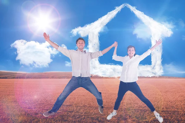 Couple jumping and holding hands — Stock Photo, Image