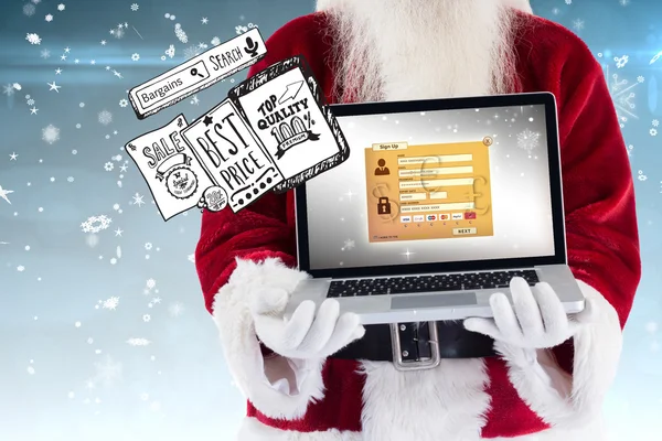 Santa Claus präsentiert einen Laptop — Stockfoto