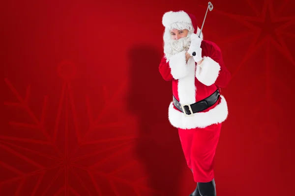 Složený obraz veselý santa Claus hrát golf — Stock fotografie