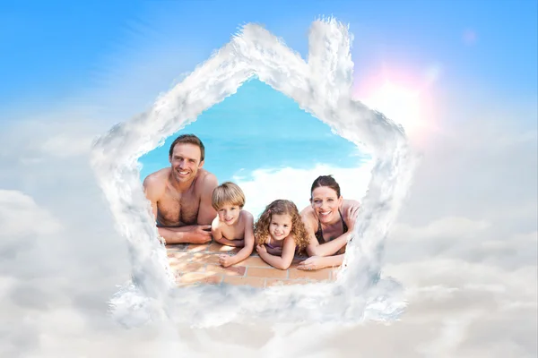 Happy family beside the swimming pool — Stock Photo, Image