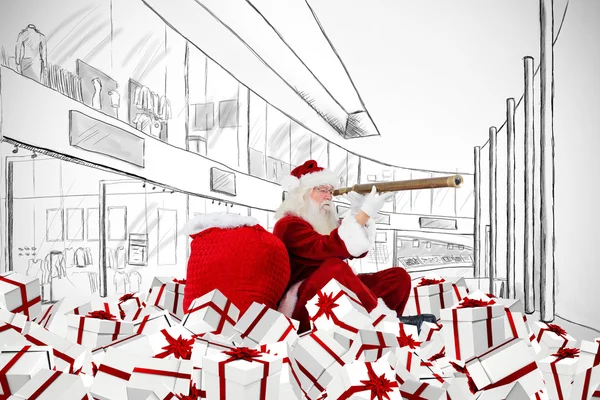 Santa patrząc przez teleskop — Zdjęcie stockowe