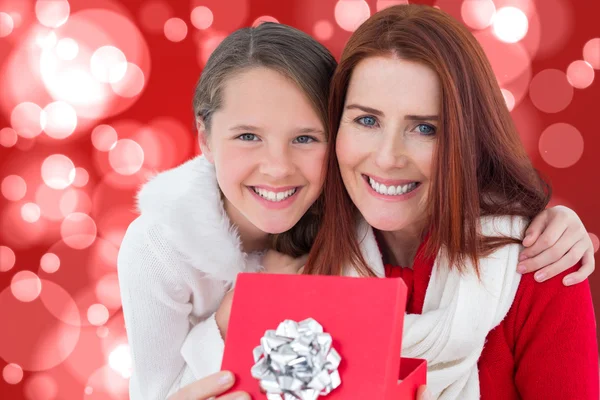 Mother and daughter with gift — Stock Photo, Image