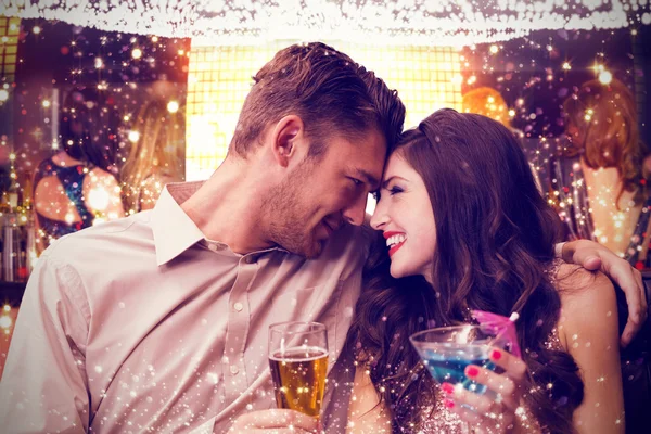 Composite image of cute couple drinking — Stock Photo, Image