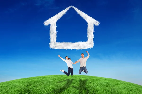 Couple jumping and holding hands — Stock Photo, Image