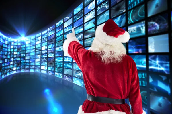 Santa claus points at something — Stock Photo, Image