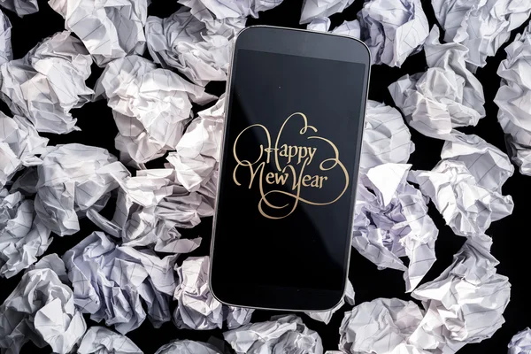 Szczęśliwego nowego roku przeciwko smartphone — Zdjęcie stockowe
