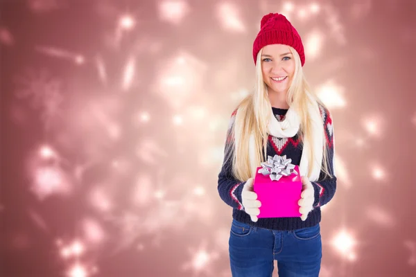 Festive blonde holding a gift — Stock Photo, Image