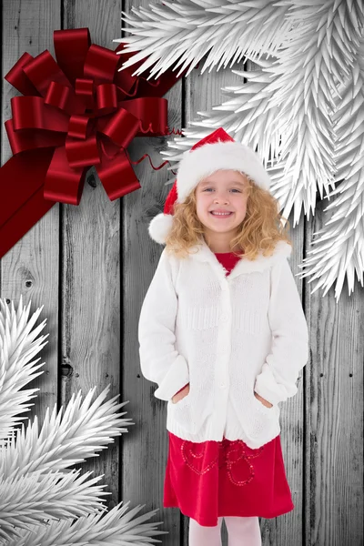 Imagen compuesta de la niñita festiva sonriendo a la cámara — Foto de Stock