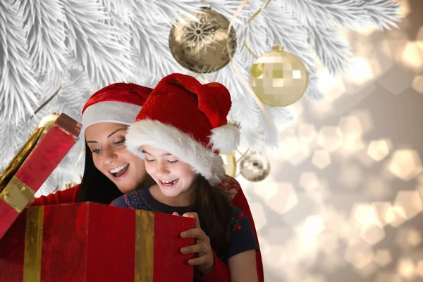 Mother and daughter opening gift — Stock Photo, Image