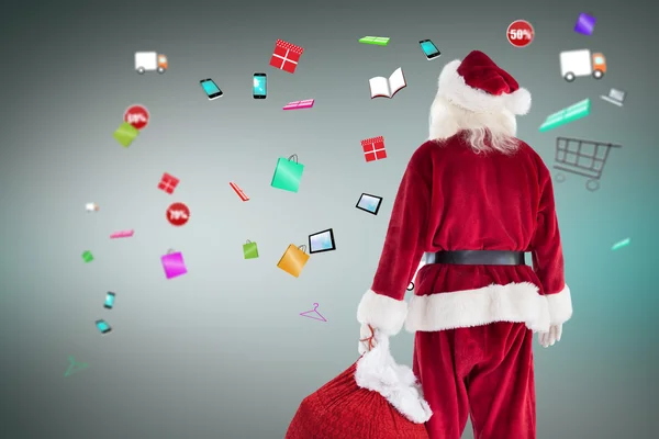 Santa bära säck av gåvor — Stockfoto