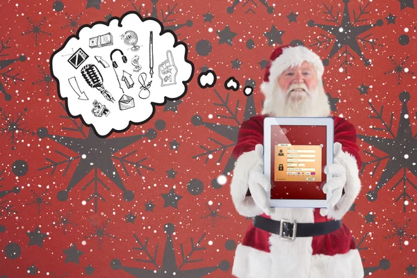 Composite image of santa presents a tablet pc — Stock Photo, Image