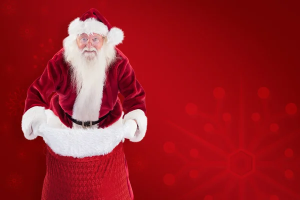Papai Noel abrir seu saco vermelho — Fotografia de Stock