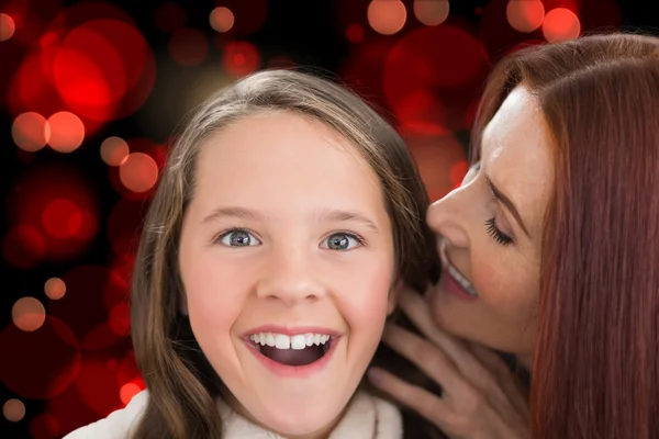 Imagem composta de mãe e filha contando segredos — Fotografia de Stock