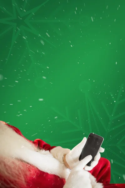 Santa using smartphone — Stock Photo, Image