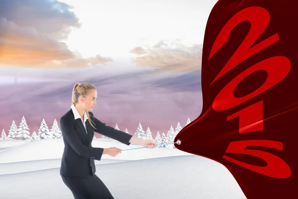 Focused blonde businesswoman pulling a rope — Stock Photo, Image