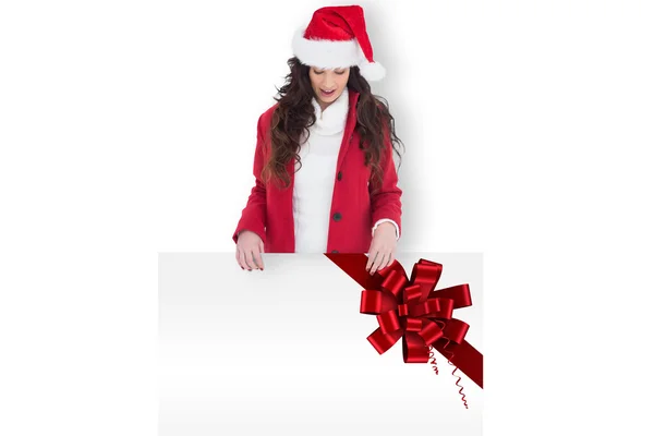 Festive brunette showing poster — Stock Photo, Image