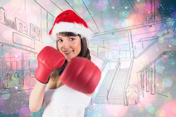 Festive brunette punching with boxing gloves — Stock Photo, Image