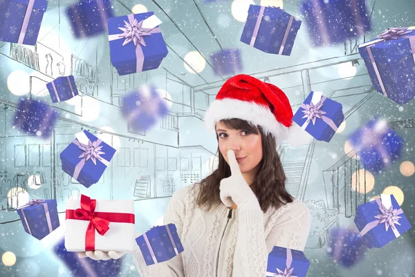 Composite image of festive brunette keeping a secret — Stock Photo, Image