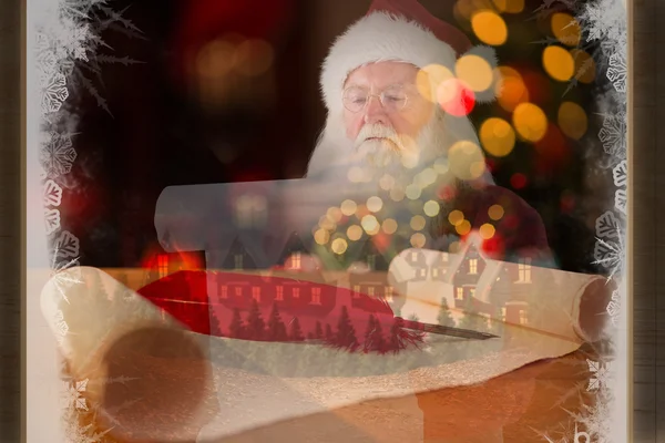 Santa claus reads a list — Stock Photo, Image