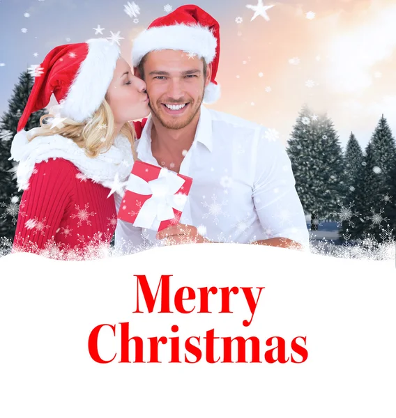 Composite image of young festive couple — Stock Photo, Image