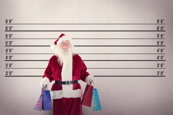 Santa carries some Christmas bags — Stock Photo, Image