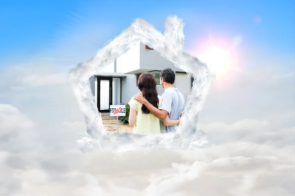 Composite image of newlyweds with their new house — Stock Photo, Image