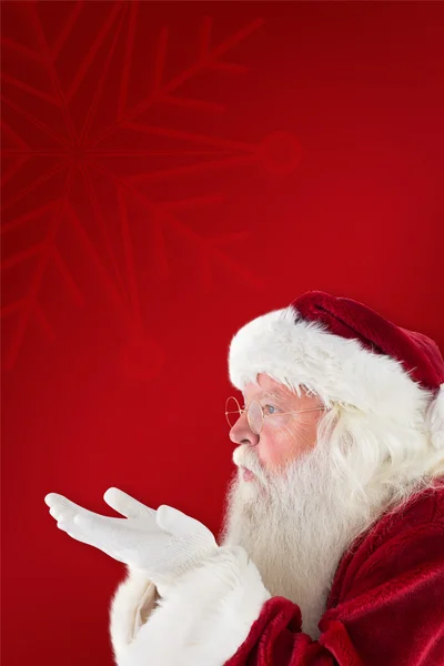 Santa Claus wegblaast iets — Stockfoto