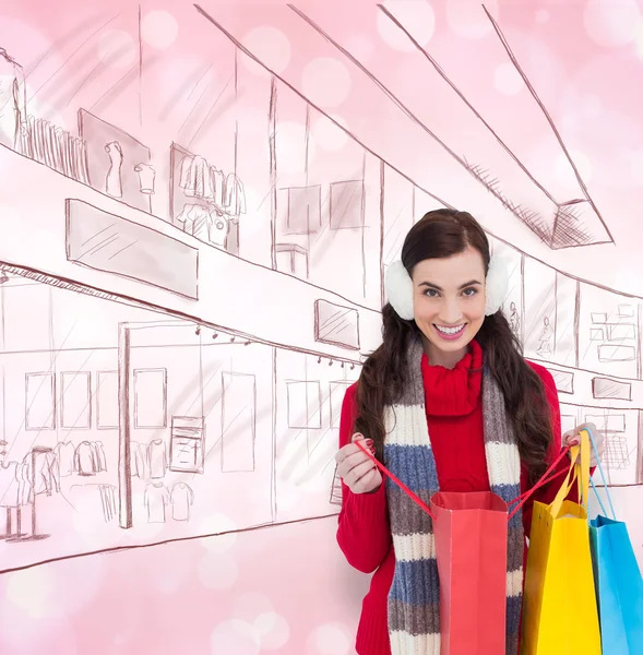 Brunette in winter kleding bedrijf shopping tassen — Stockfoto