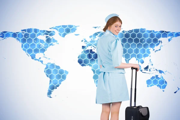 Air hostess leaning on suitcase — Stock Photo, Image