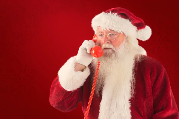 Babbo Natale sul suo telefono rosso — Foto Stock