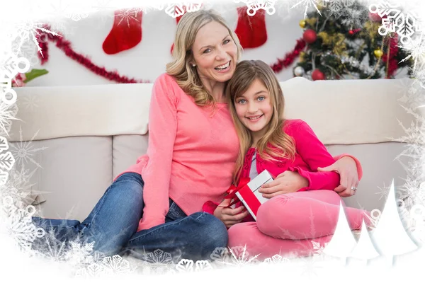 Festive mother and daughter smiling — Stock Photo, Image