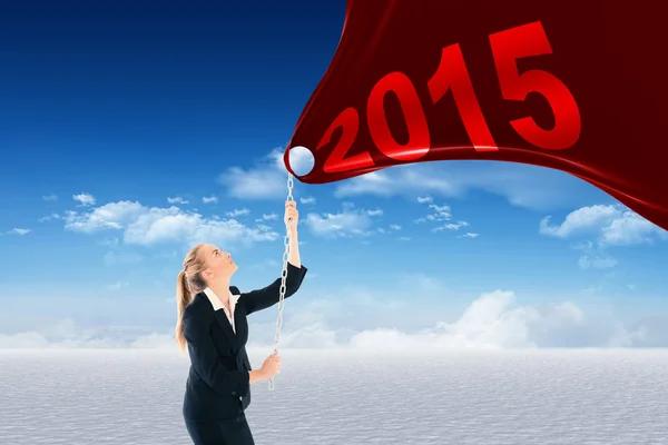 Businesswoman pulling a chain — Stock Photo, Image