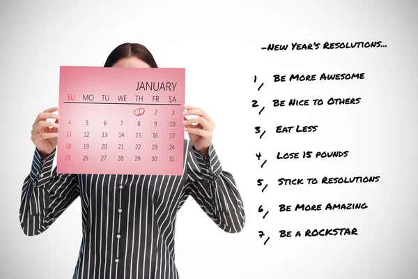 Geschäftsfrau zeigt einen Kalender vor — Stockfoto