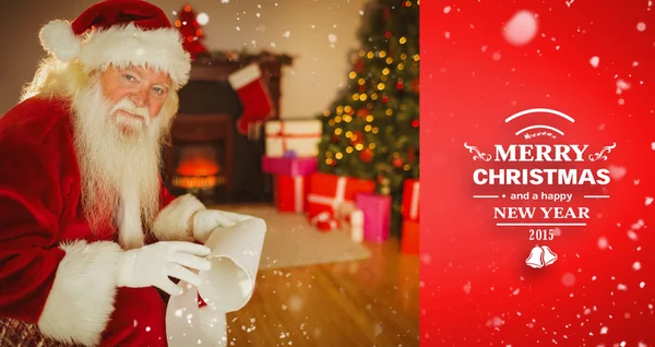 Santa Claus sosteniendo un pergamino — Foto de Stock