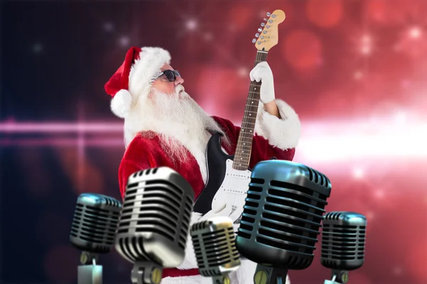 Santa tocando guitarra elétrica — Fotografia de Stock