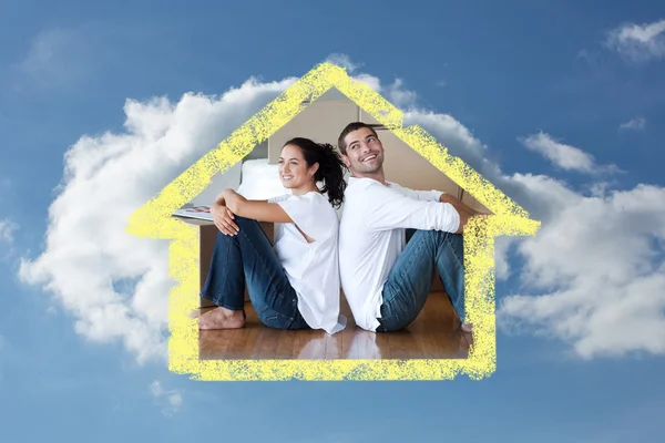 Radiant couple with unpacking boxes moving — Stock Photo, Image