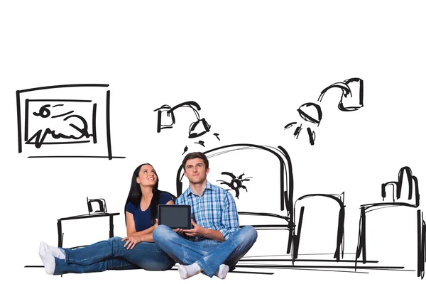 Couple sitting on floor with tablet — Stock Photo, Image