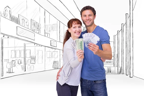 Couple holding fans of cash — Stock Photo, Image