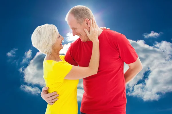 Happy mature couple hugging and smiling — Stock Photo, Image