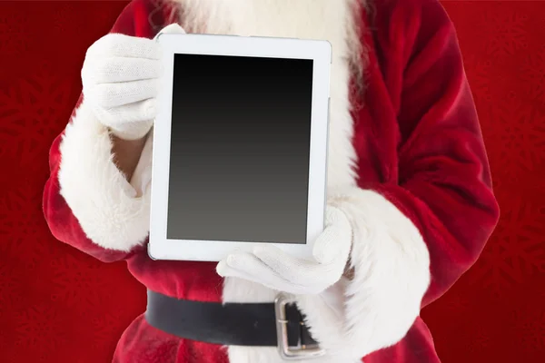 Santa claus mostrando tablet pc — Fotografia de Stock