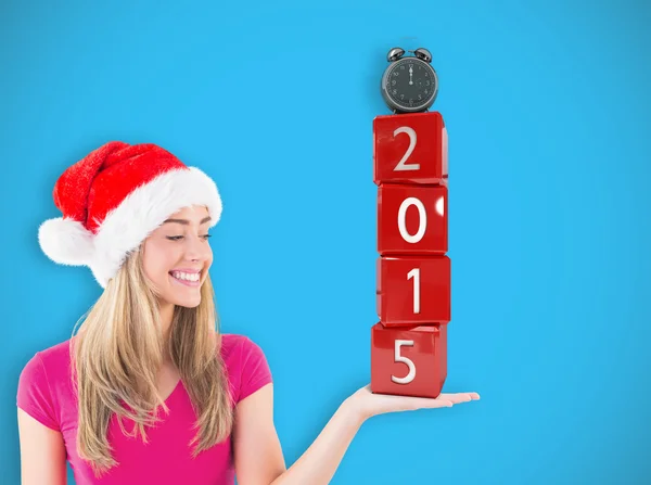 Festive blonde presenting with hand — Stock Photo, Image