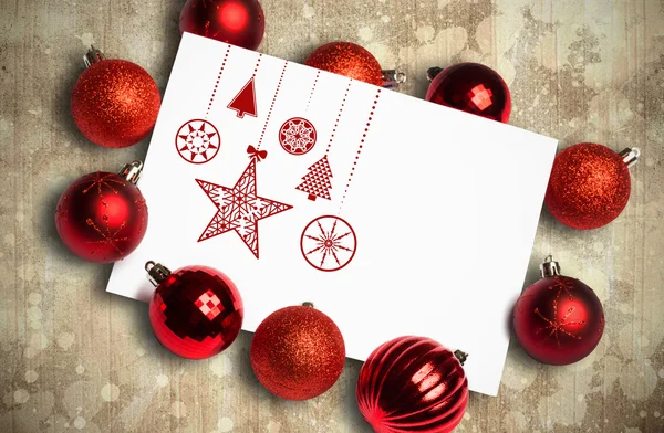 Composite image of hanging red christmas decorations — Stock Photo, Image