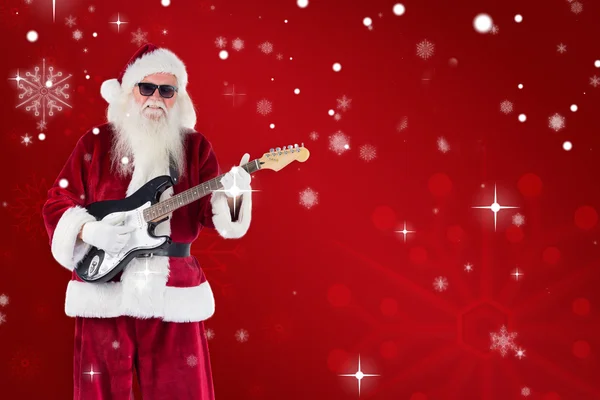 Santa Claus speelt gitaar — Stockfoto