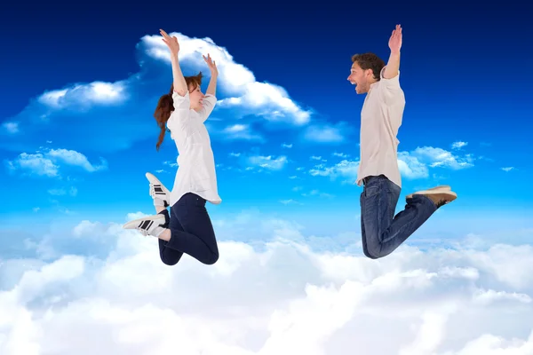 Couple jumping in the air — Stock Photo, Image